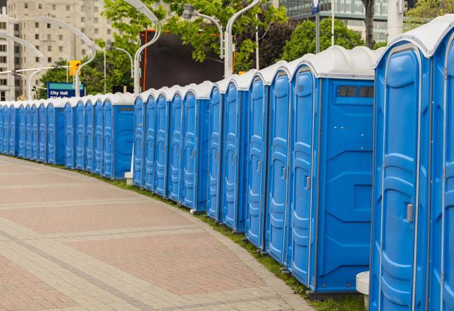 a row of sleek and modern portable restrooms at a special outdoor event in Abernathy